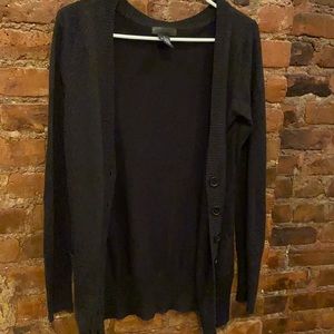 Shiny black buttoned sweater